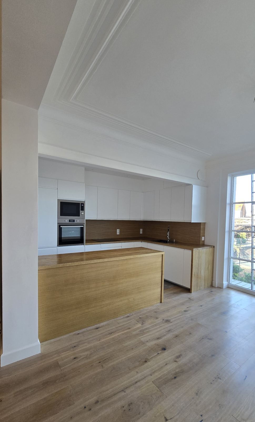 Open living room with oak island kitchen